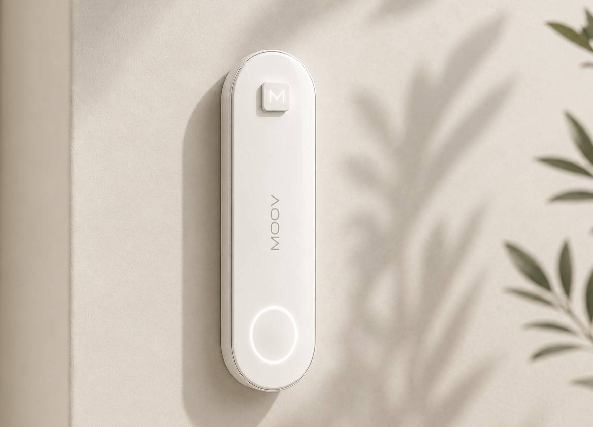 MOOV device mounted on a warm beige wall with soft botanical shadows